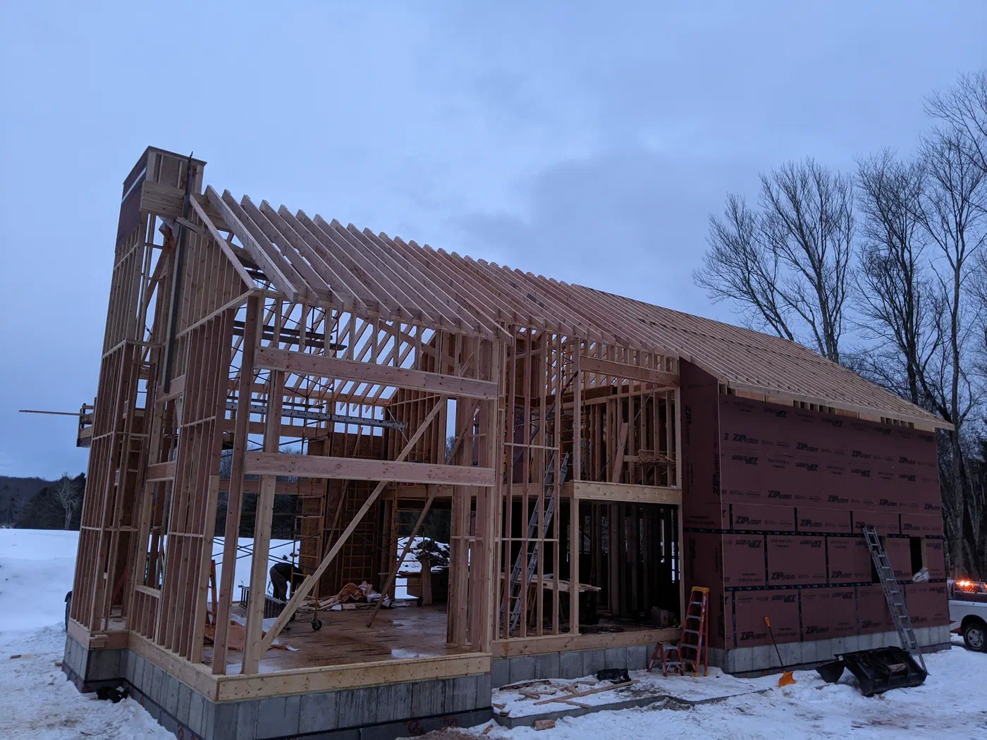 The tall gable and roof framing