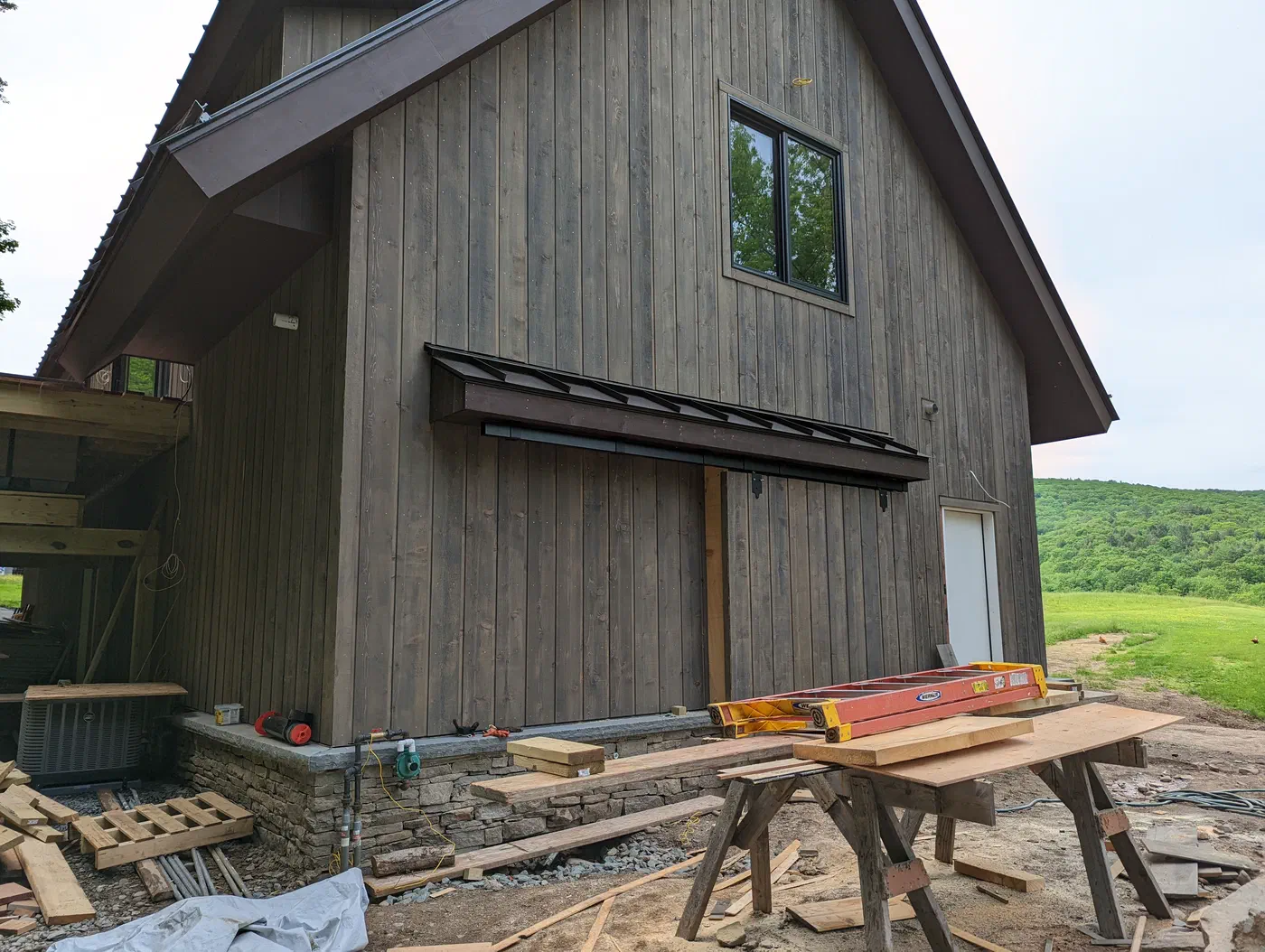 Metal awning over a barn-style door