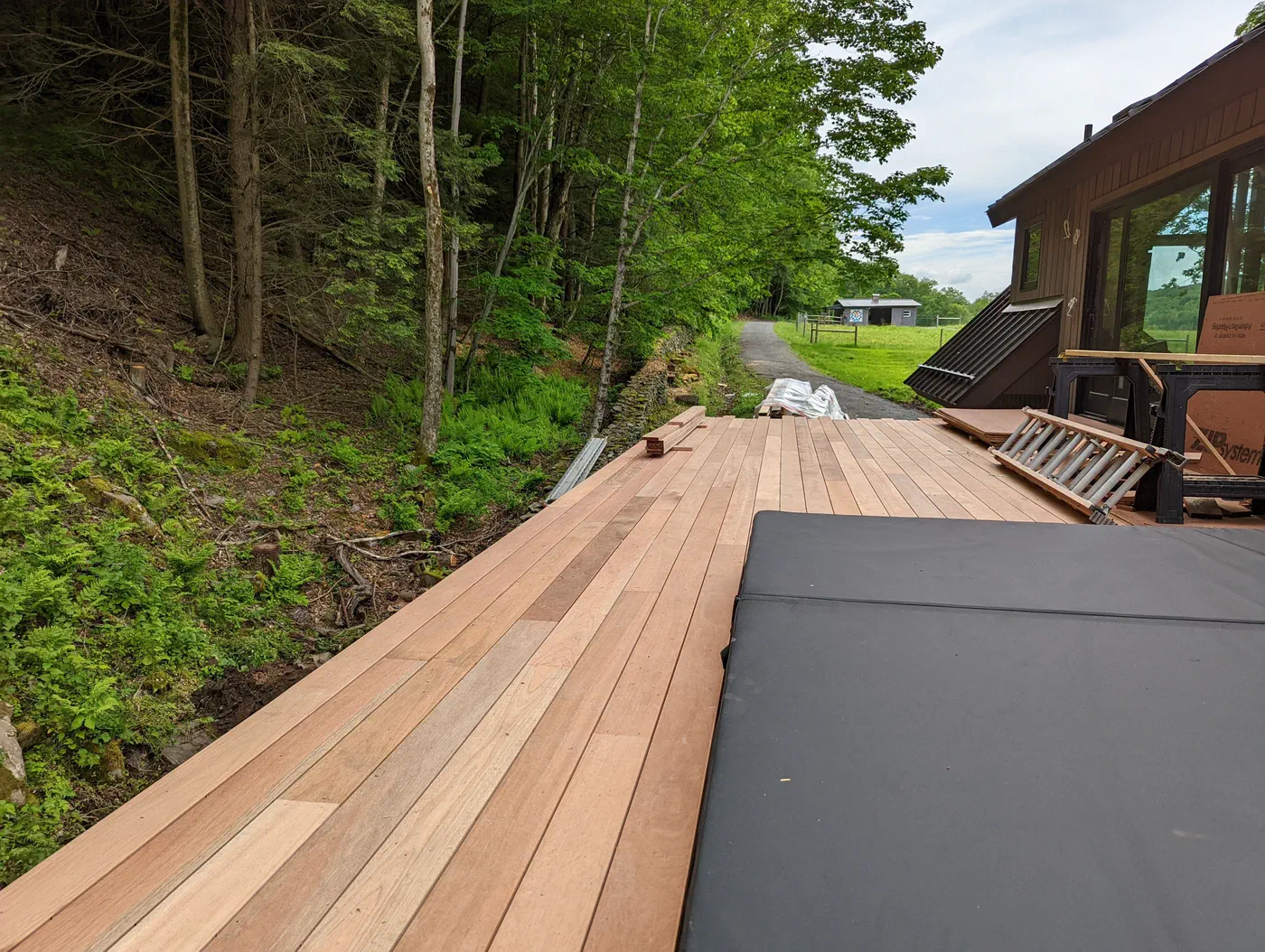 Hardwood deck boards going down