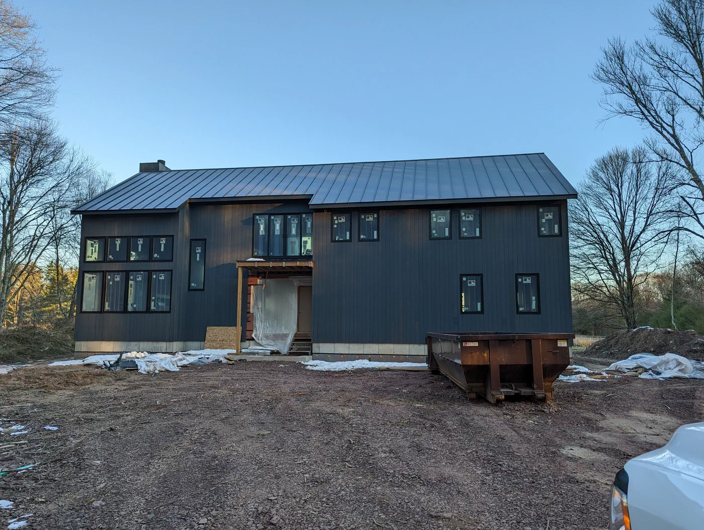 Front elevation under a standing-seam roof