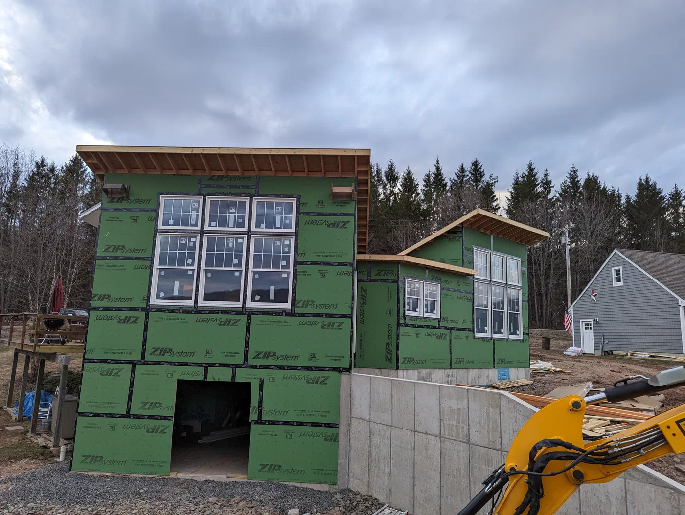 The addition, sheathed and ready for siding