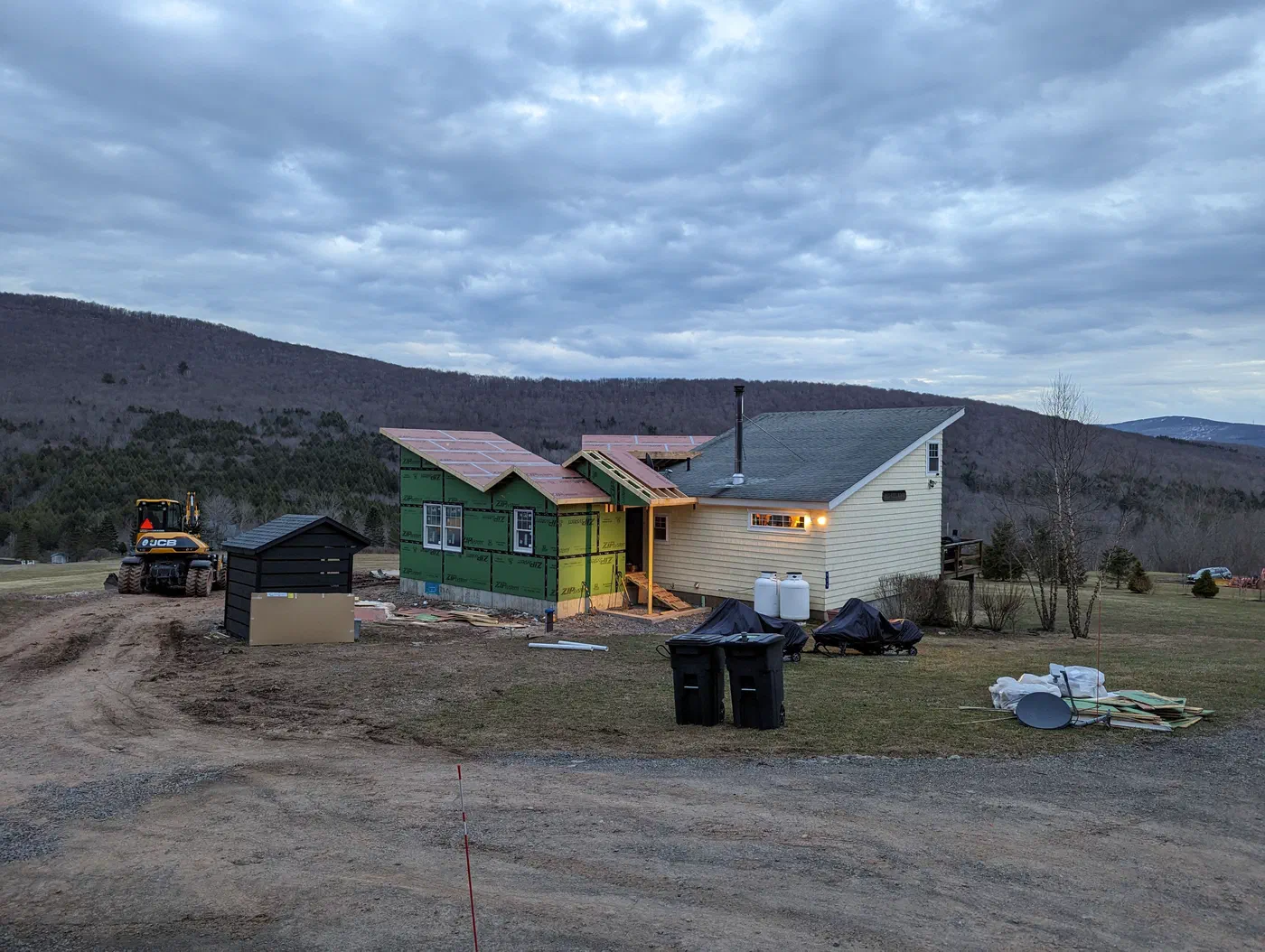 At dusk, joined to the original house