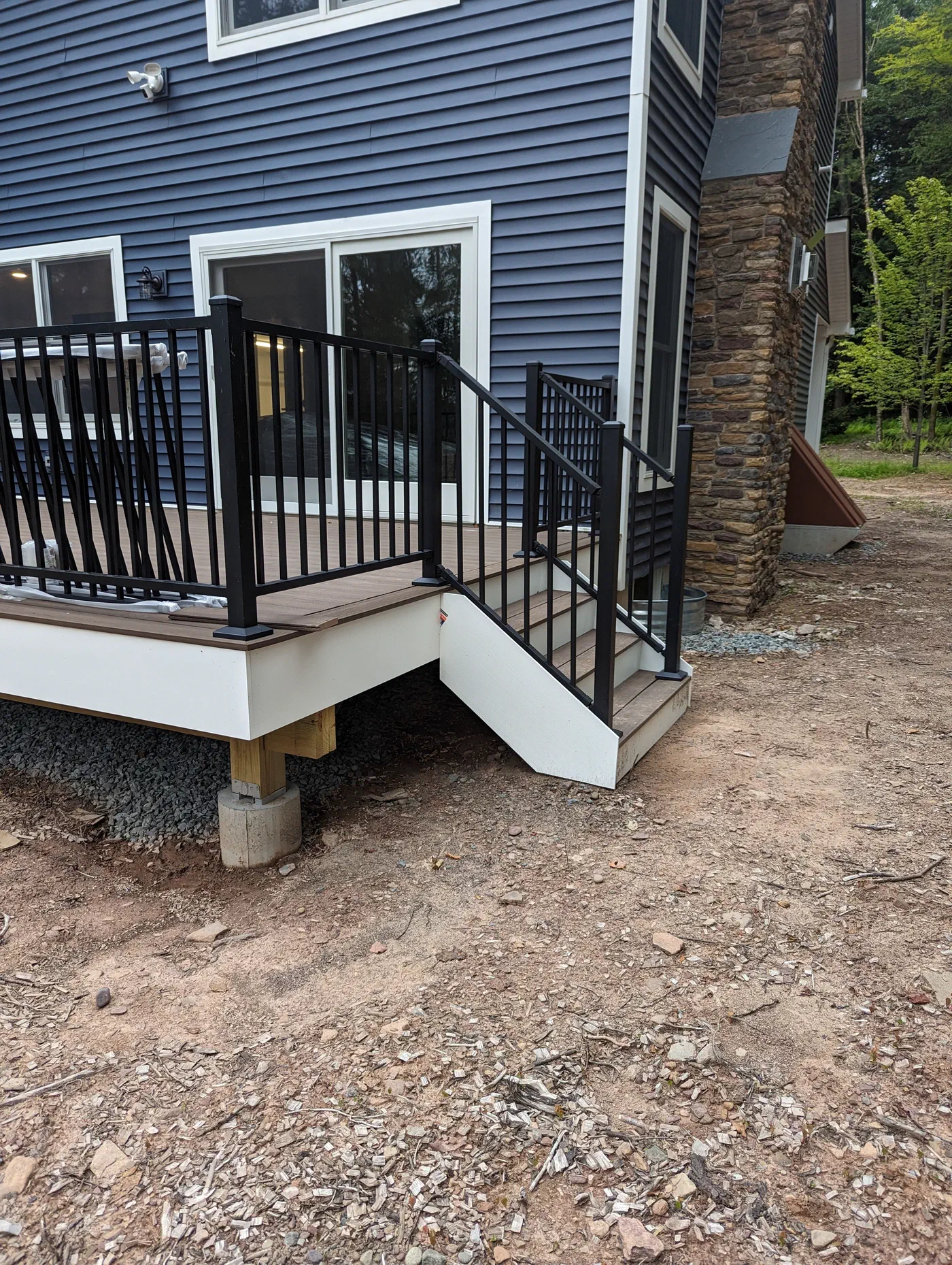 Back deck and stairs with black railings