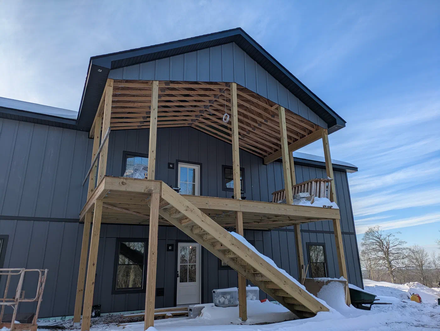 Two-level porch with timber stairs