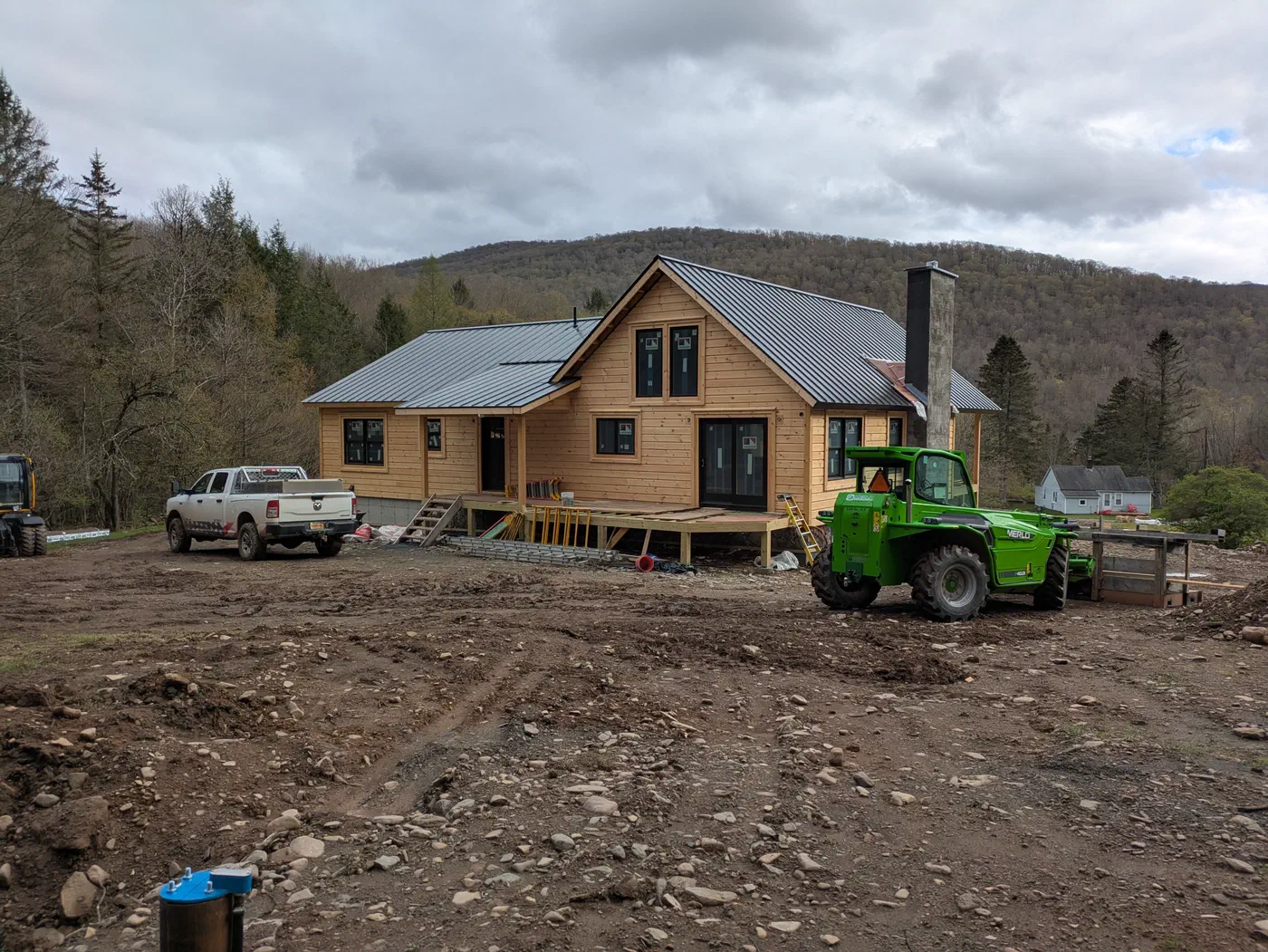 The house with the mountains behind